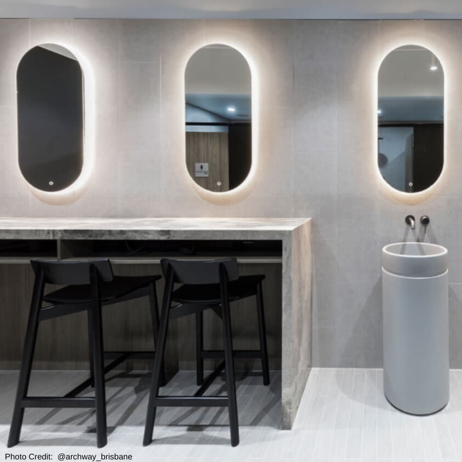 Styled Image of a 65cm Black Timber Stool in a Corporate Bathroom Space