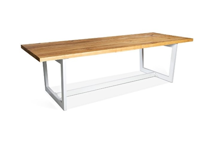 Rectangular dining table, light natural timber top, white steel open rectangular base at each end joined by central white steel bar at floor level